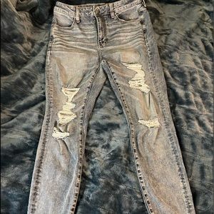 American Eagle 360 next level stretch skinny jeans, distressed with raw hem!